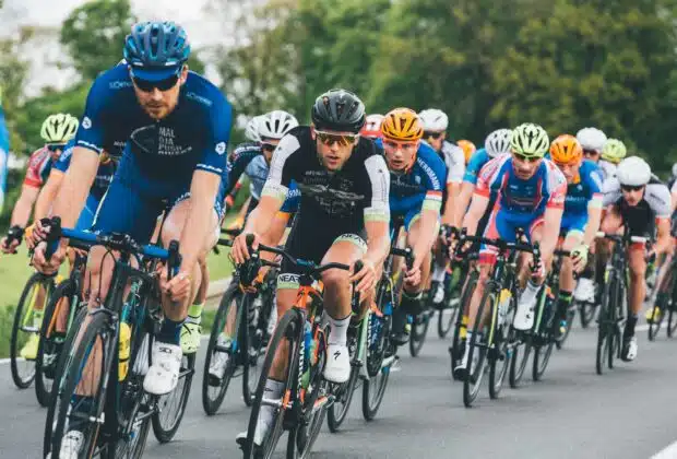 group of cyclist on asphalt road